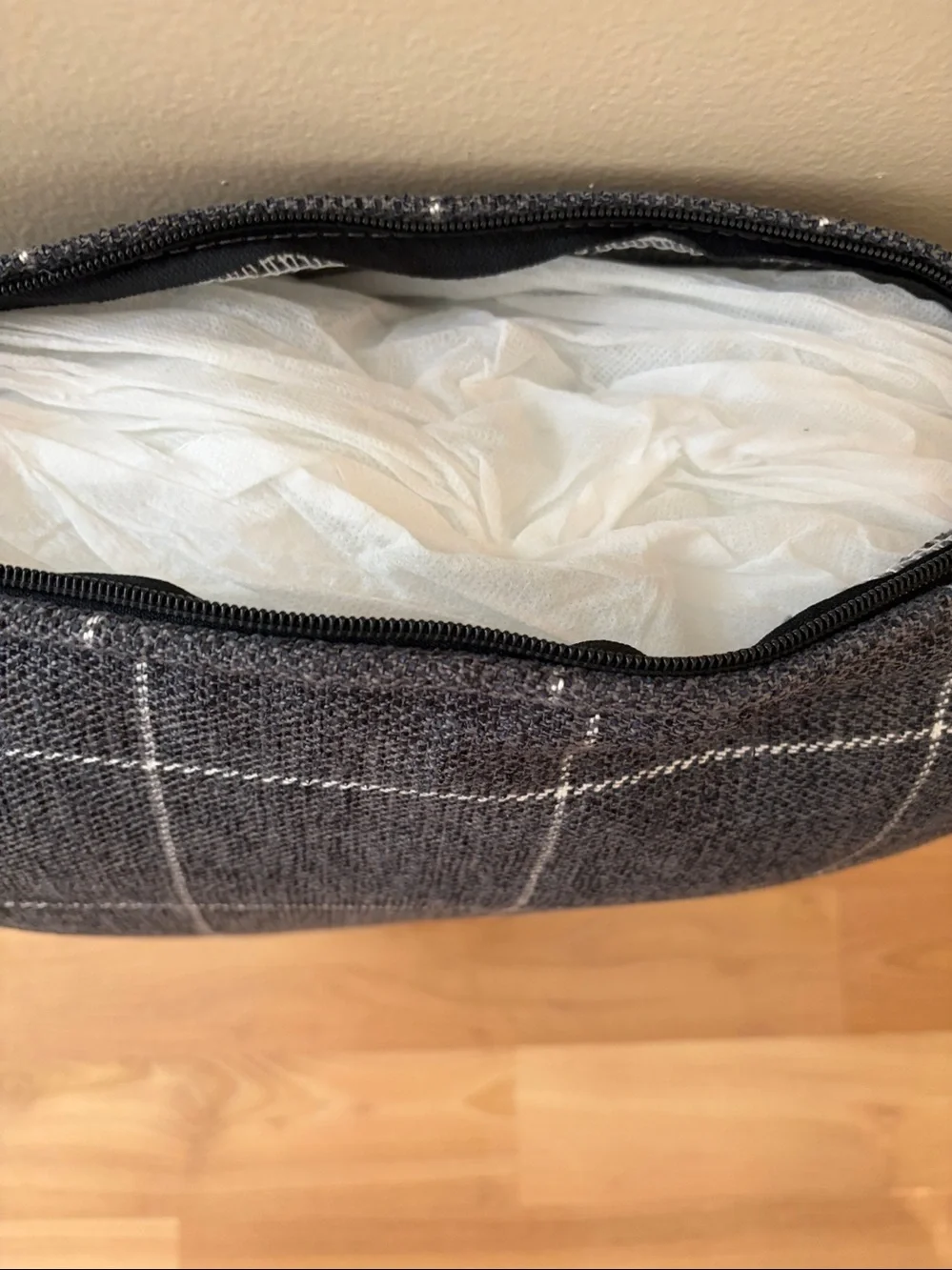 Gray and white checker accent pillow with side zipper.